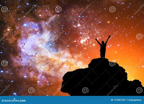 Milky Way Night Sky With Stars And Silhouette Of A Man With Raised Up