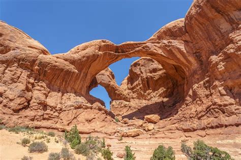 An Arch Shaped Rock Formation In The Desert