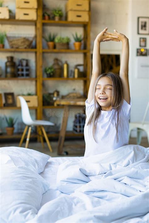 Vertical Photo Of A Ten Year Old Girl Woke Up And Stretching She
