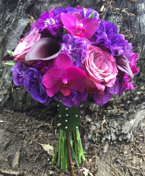 purple bouquet for diana with phalaenopsis stock lisianthus calla lily s and roses purple