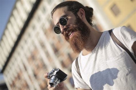 Premium Photo Hipster Guy Using A Camera