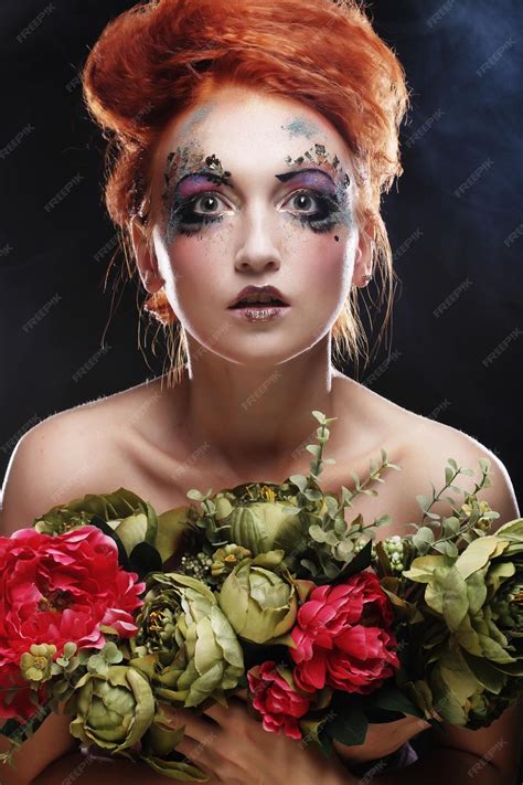 premium photo beautiful redhair woman holding flowers