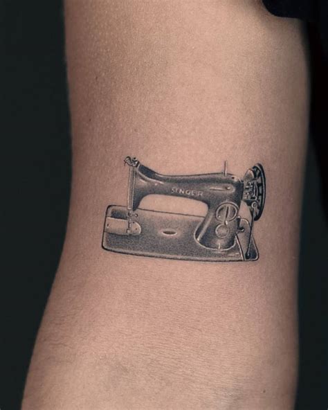Micro Realistic Sewing Machine Tattoo Located On The