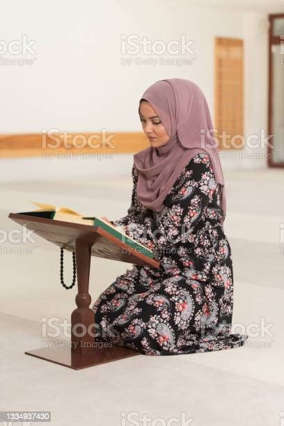 Muslim Woman Is Reading The Koran Stock Photo Download Image Now