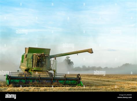 Wheat Harvest Combine Harvester Harvesting Wheat With Grain Dust
