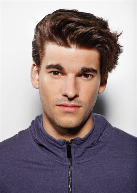 Maybe you would like to learn more about one of these? Men's hairstyle with one side slicked towards the back