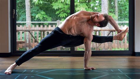 Man On The Mat Flying Warrior Pose Om Yoga Magazine