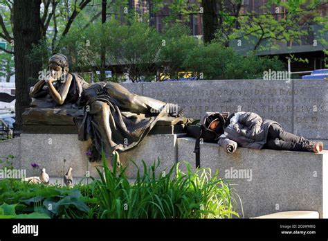 A Person Naps At The Foot Of The Bronze Statue Memory By Sculptor