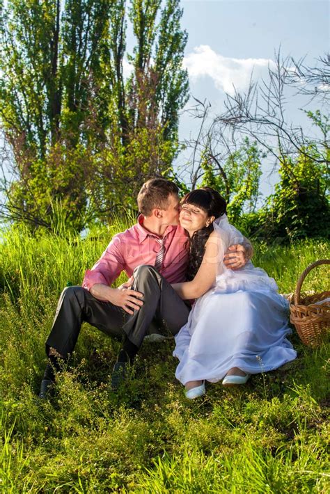 Newlyweds Hugging At Park During Picnic Stock Image Colourbox