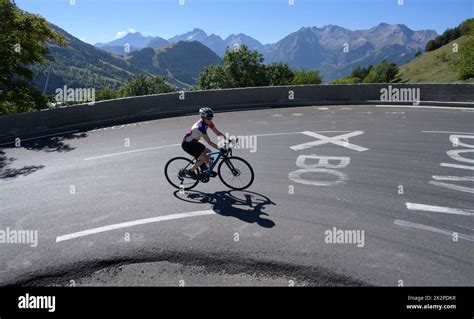 Mature Female Road Cyclist Riding Through The Famous Bend 3 On The Tour