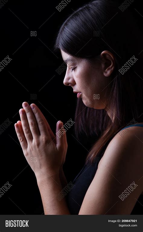 faithful woman praying image and photo free trial bigstock