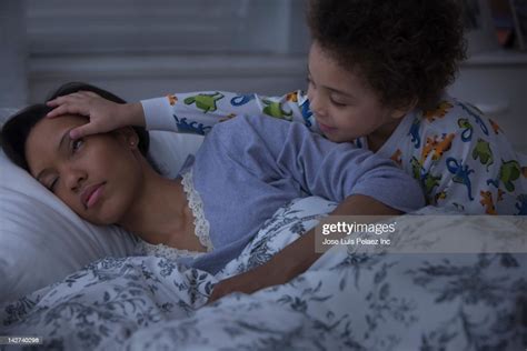 Son Waking Up Sleeping Mother High Res Stock Photo Getty Images