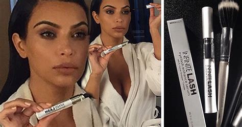 Kim Kardashian Bares Cleavage In Plunging Robe As She Puts On Makeup