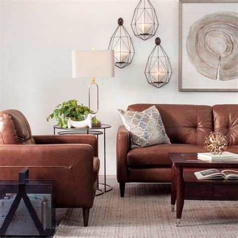 Living Room With Modern Brown Leather Furniture White Walls Gold