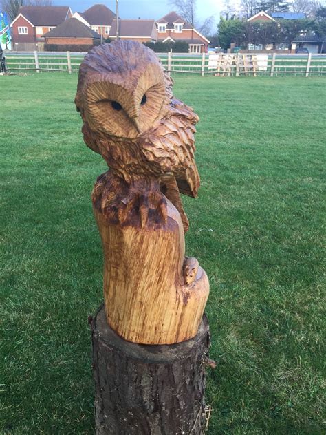 Chainsaw Carved Owl With A Mouse Hiding Out Of Oak Chainsaw Wood