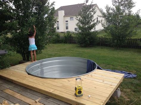 Galvanized Stock Tank Turned Into A Simple Diy Pool Stock Tank Tank Swimming Pool Tank Pool