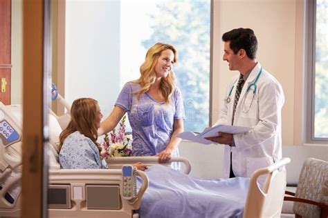 Doctor Talks To Mother With Teenage Daughter In Hospital Stock Image Image Of Girl Doctor