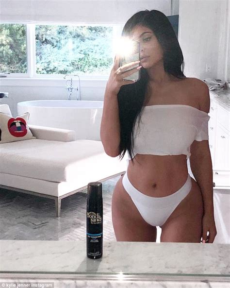 Kylie Jenner Shows Off Her Tiny Waist As She Supports Travis Scott