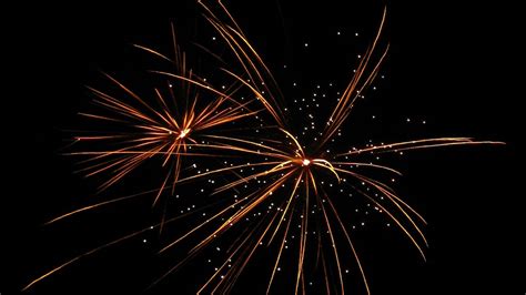 Download Wallpaper 1366x768 Fireworks Sparks Darkness Glow Night