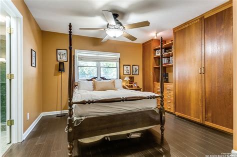 This San Antonio home comes with a two-story library featuring etched