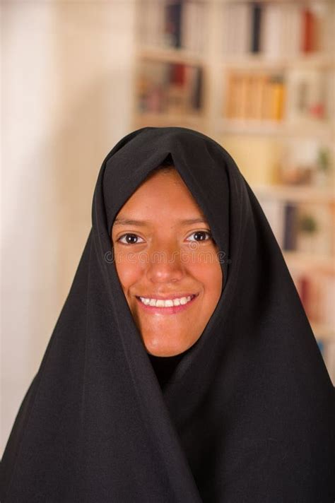 Portrait Of A Beautiful Smiling Muslim Girl Wearing A Hijab In A Blurred Background Stock Image