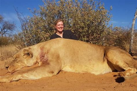 Safari Couple Kiss Over Body Of Dead Lion In Trophy Hunting Horror