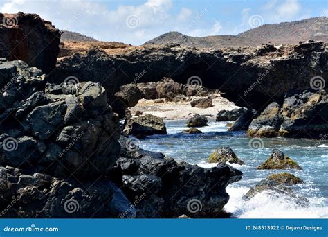 Stunning Natural Rock Arch On The Coast Of Aruba Stock Photo Image Of