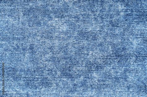 Jeans In Acid Wash Blue Denim Background Texture Close Up Faded