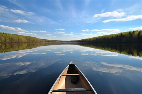 Premium Ai Image Canoe On Glassy Lake With Tranquil Reflections And
