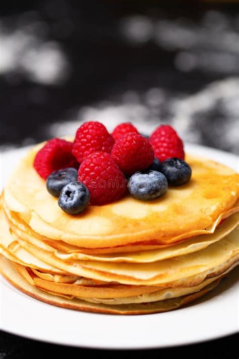 Closeup Image Of Plate Of Pancakes Blueberries Raspberries And