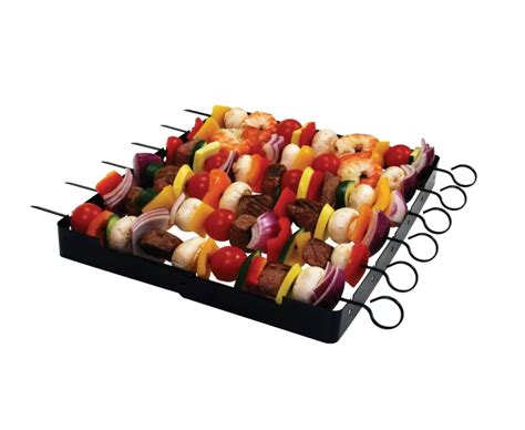 An Assortment Of Skewers With Meat And Vegetables On Them