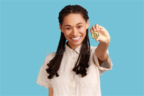 Attractive Woman Holding Out Gold Bitcoin Showing Electronic Coin