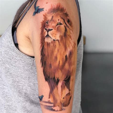 Watercolor Lion Tattoo On The Upper Arm