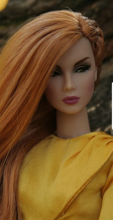 a doll with long red hair wearing a yellow dress and text that reads how to make your own wig