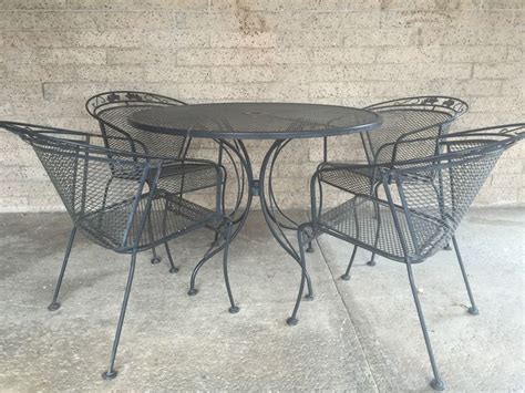 Black Wrought Iron Outdoor Patio Set With Round Table And Four Chairs