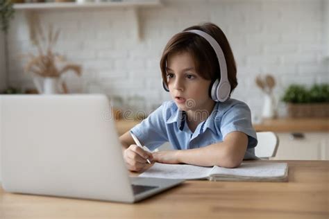 Boy Sit At Table Studying At Home Online Use Laptop Stock Image Image