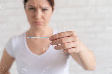 Sad Woman Shows A Negative Ovulation Test The Concept Of Female Infertility And Low Luteinizing