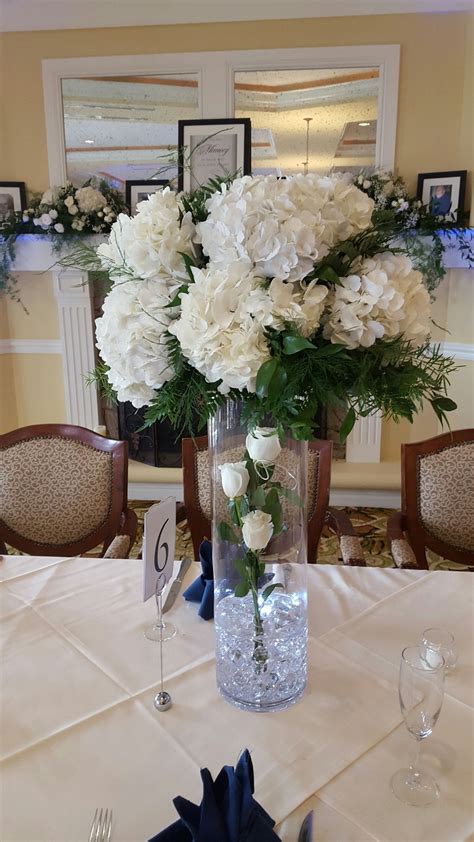 White Hydrangea Centerpiece With Roses And Submersible Lighting With