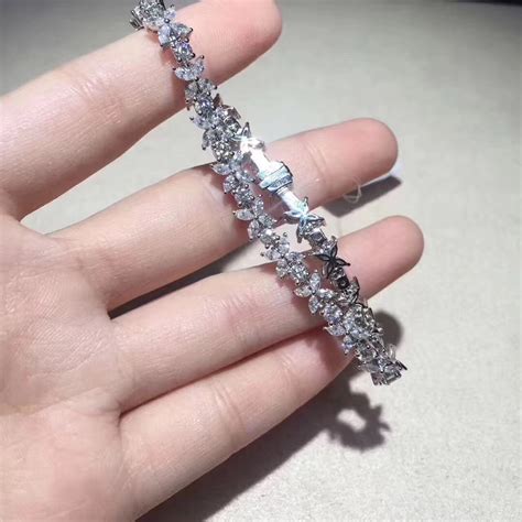 This exquisite piece features very high grade round brilliant cut stunning diamond and platinum tennis bracelet created by tiffany & co. Tiffany Victoria Cluster Tennis Bracelet in Platinum with ...