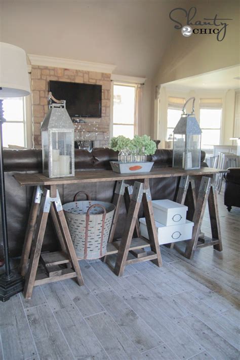 In a narrow hallway, go for a very narrow table. DIY Sawhorse Console Table - Shanty 2 Chic