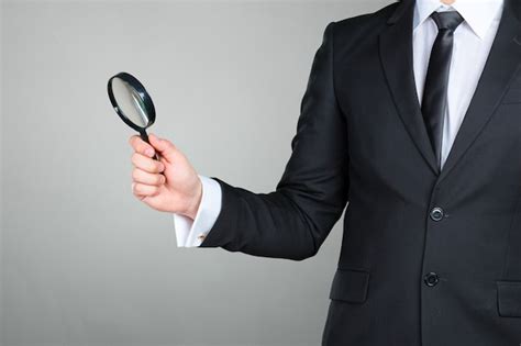 Premium Photo Business Man Holding Magnifying Glass Concept