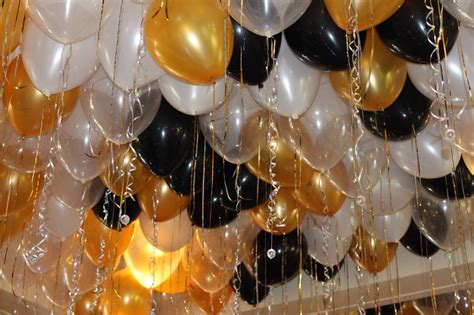This flexible balloon decorating strip saves time, money and headaches while setting up and leave extra on the ends for fastening the decoration once complete. Black & Gold Ceiling Balloons Black & Gold Loose Ceiling ...