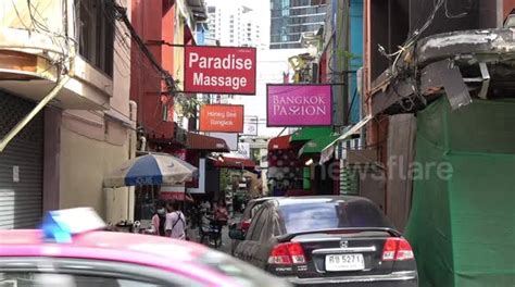 bar and massage parlour signs on sukhumvit soi 22 red light district in bangkok thailand buy