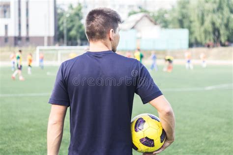 Man Holding A Soccer Ball On The Field Stock Image Image Of Male