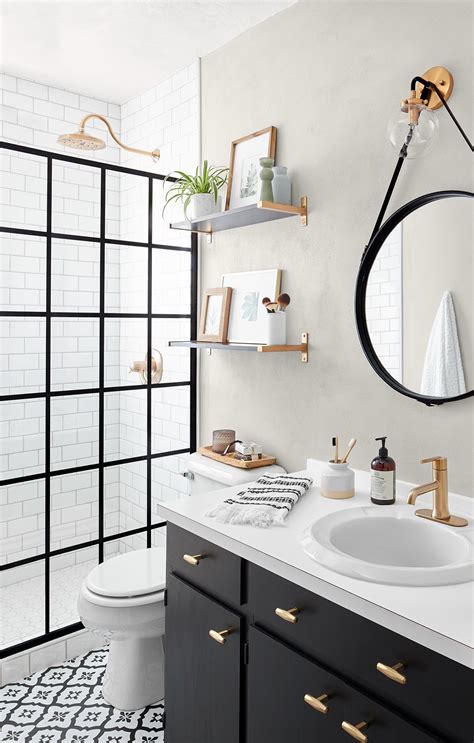 The black and white tub and sink ground the decor even more. This Small Bath Makeover Blends Budget-Friendly DIYs and ...