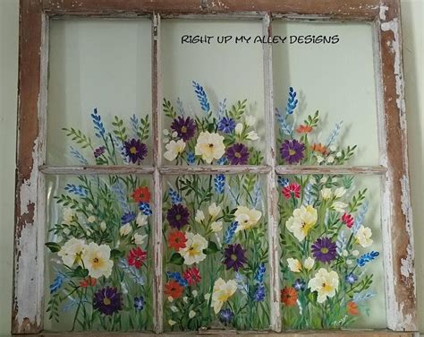 An Old Window With Flowers Painted On It