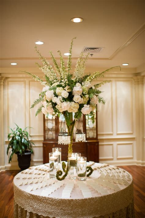Tall Flower Arrangement With Ivory Roses And Delphiniums Wedding Reception Table Decorations
