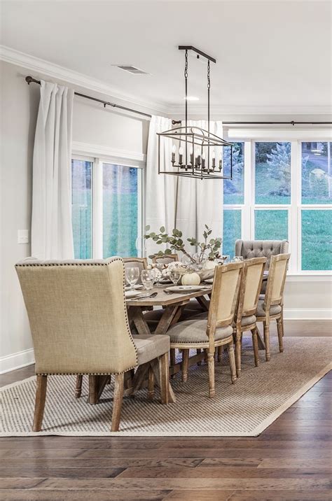 A Beautiful Dining Room Setting With Warm Wood And The Traditional Piedmont Long Chandelier From