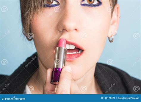 Girl Putting Lipstick On Her Lips With Lipstick Stock Image Image Of