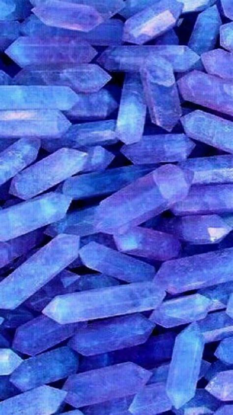 Download A Close Up Of A Bunch Of Blue Crystals Wallpaper